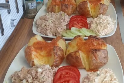 Thumbnail for Cheesy jacket potatoes with tuna mix, coleslaw and salad.
