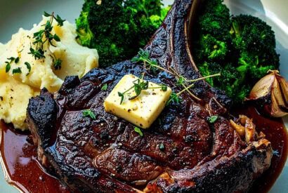Thumbnail for Cowboy ribeye steak with garlic butter, mashed potatoes and broccoli